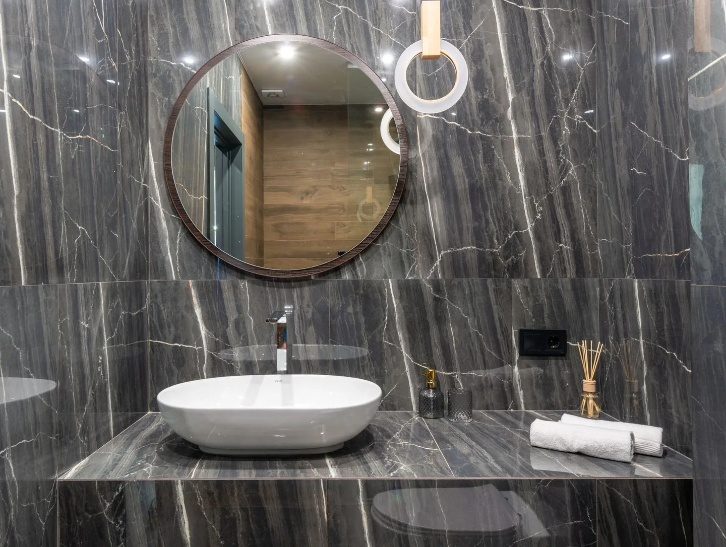 New bathroom installation in Bradford with a grey tiled walk-in shower and wall-hung vanity