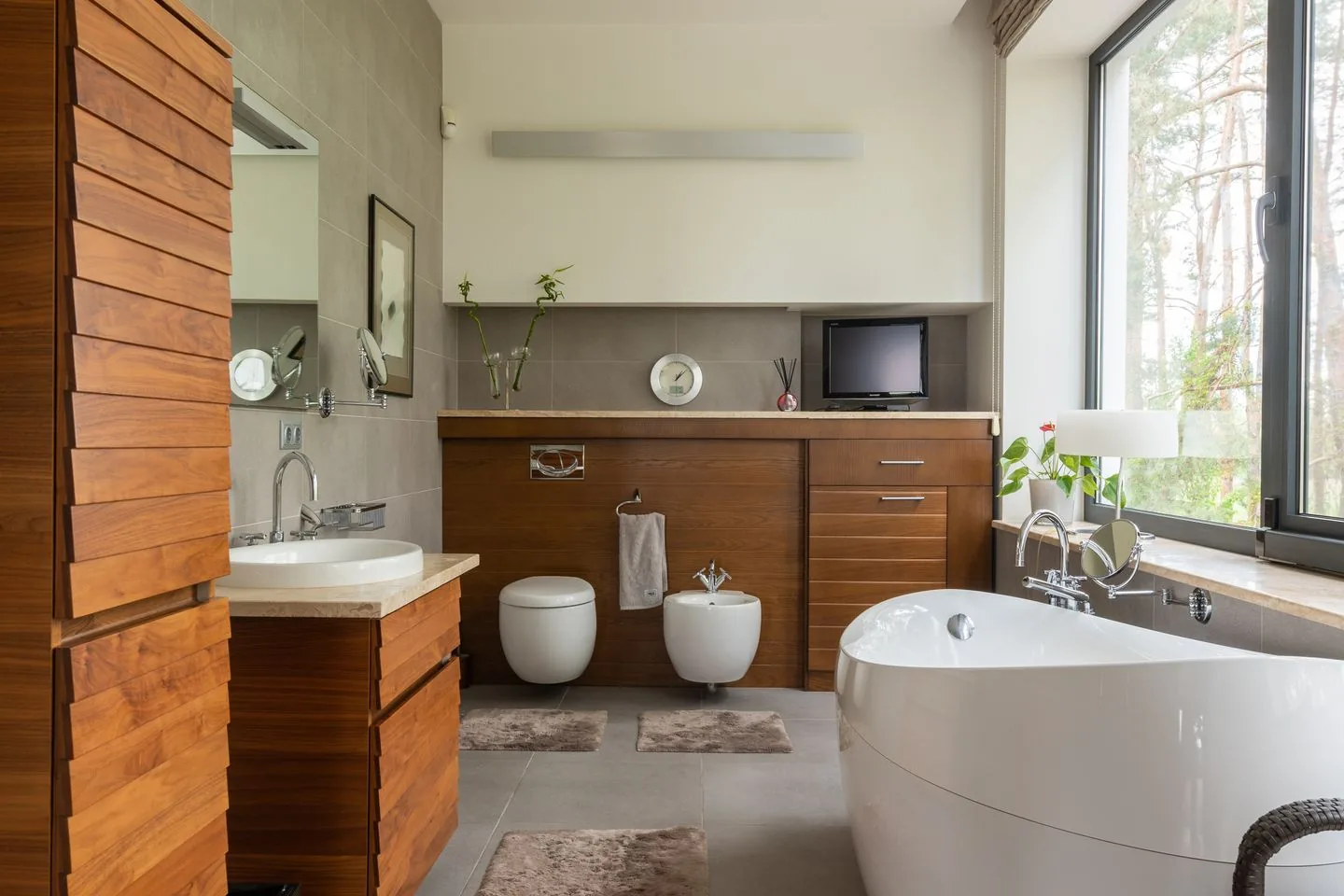 Contemporary bathroom with a freestanding bath, walk-in shower and twin basins, renovated by Maintain Home Solutions