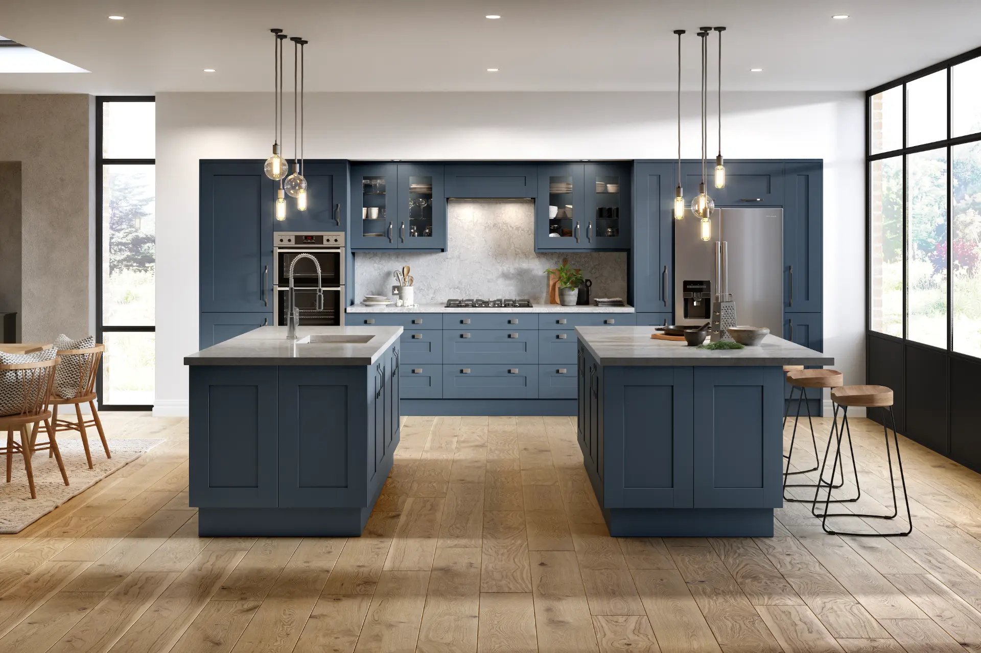 Quality kitchen installation in Leeds with navy shaker cabinets and twin stone-topped islands