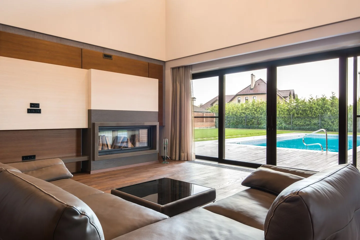 Home improvement project in Leeds showing a modern brick extension with bifold doors at twilight