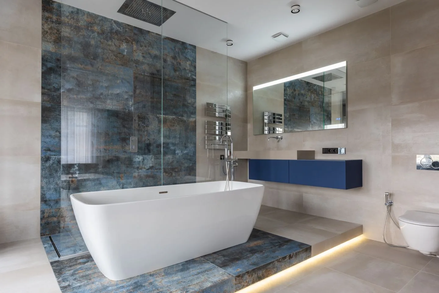 Modern bathroom installation in Leeds with a walk-in shower and contemporary tiling