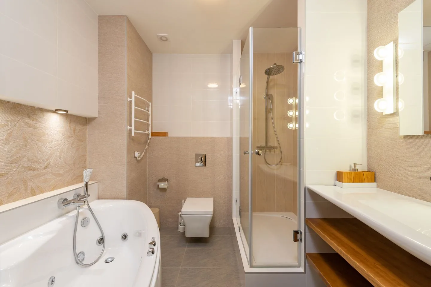 Modern grey-tiled bathroom renovation adding value to a Leeds home
